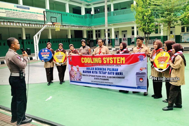 Sambangi SD Al-Azhar, Satlantas Polresta Pekanbaru Sosialisasikan Kamtibmas Pilkada Damai