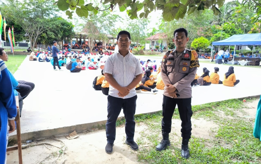 Polsek Kerinci Kanan Hadiri Lomba PBB HUT ke-79 PGRI dan Ajak Pilkada Damai 2024